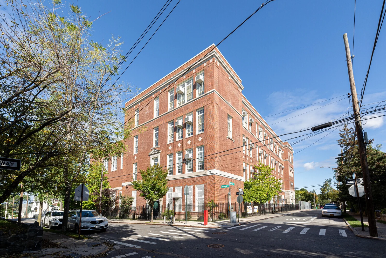 Red brick school construction timeline supported by CPM scheduling analysis.