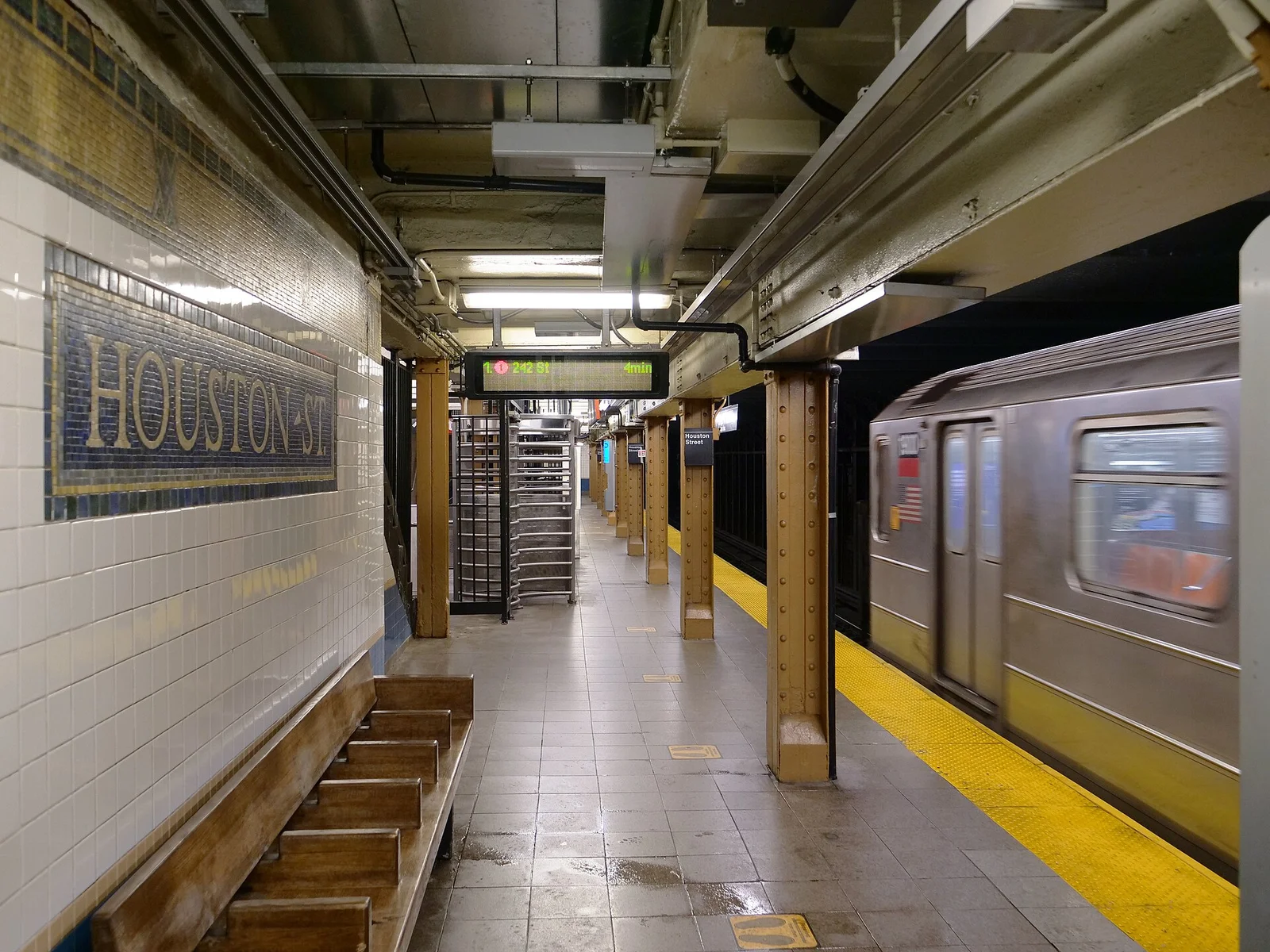 Houston Street subway station in NYC, part of public infrastructure projects reviewed by CPM Scheduling Consultants for schedule compliance.