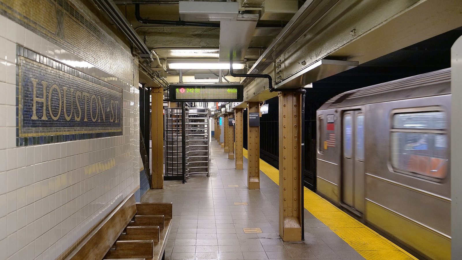 Houston Street subway station in NYC, part of public infrastructure projects reviewed by CPM Scheduling Consultants for schedule compliance.