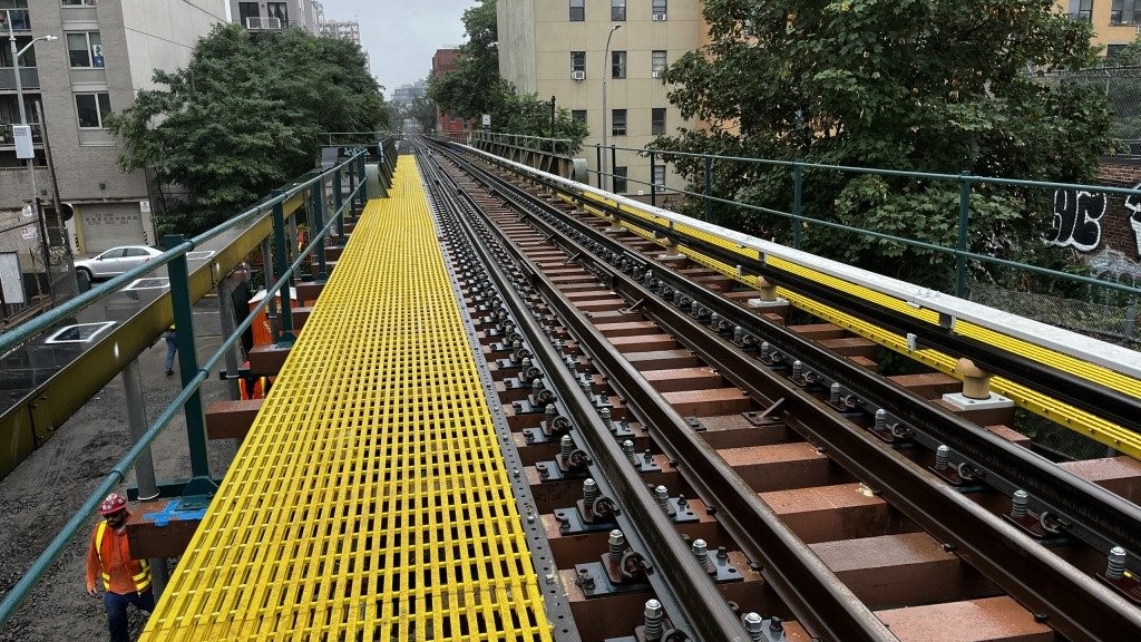 Construction company completing elevated rail track infrastructure work